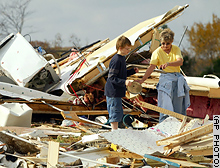 Clarksville, Tennesee, residents survey the damage to their mobile home after storms swept through the area overnight.